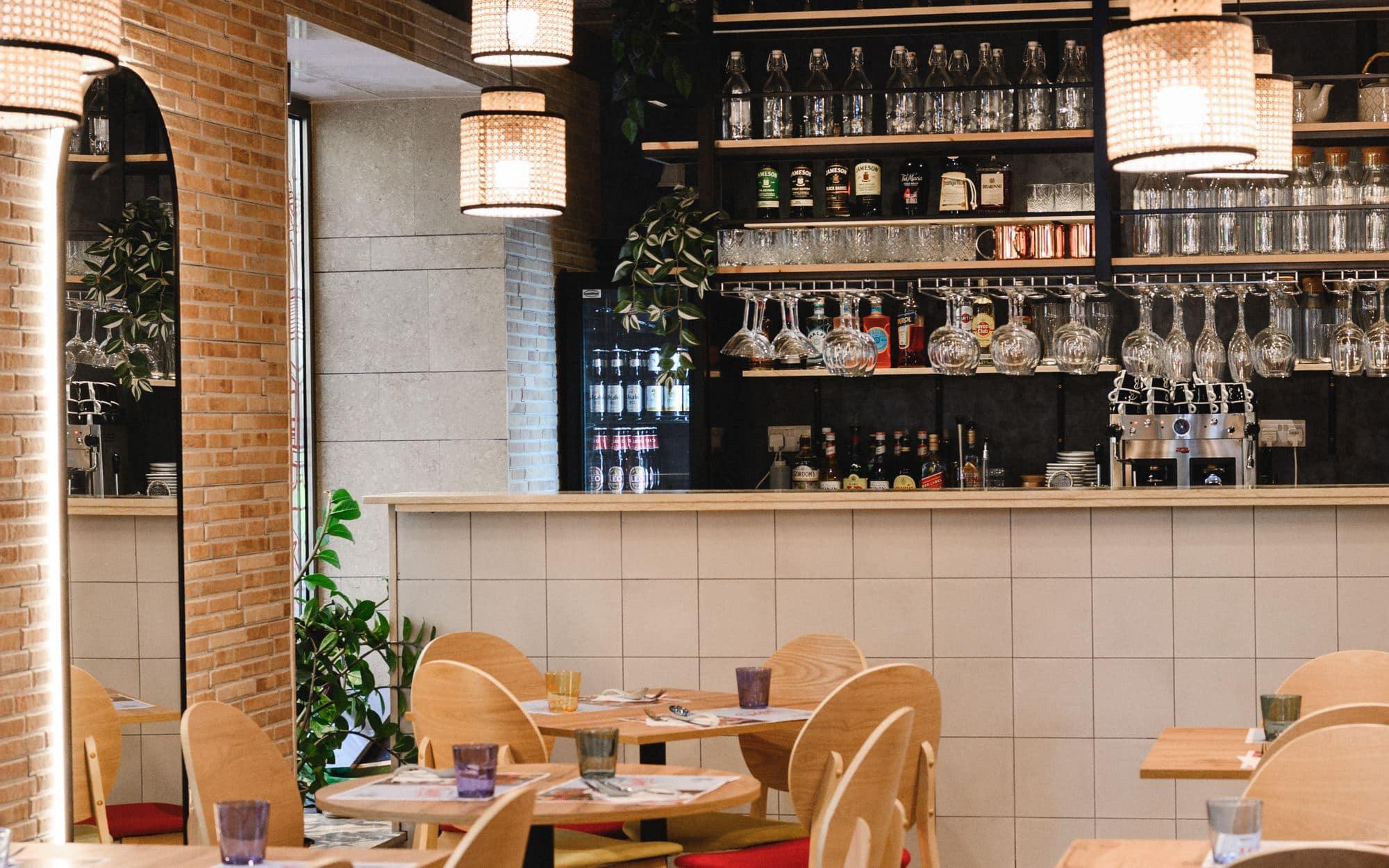 Inside Saigon's Gżira flagship — the bar with rattan pendant lights